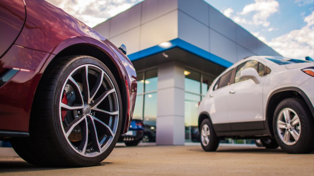 Cars outside a dealership building