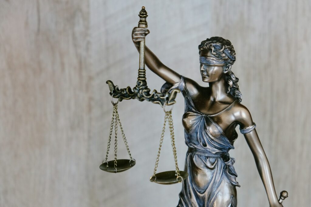 Bronze lady justice statue in a lawyer's office